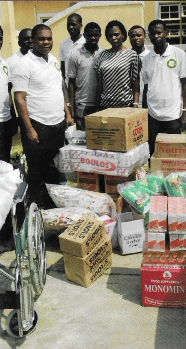 Beneficiaries receiving food items during the visitation
