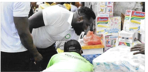 Distributing supplies at Makoko