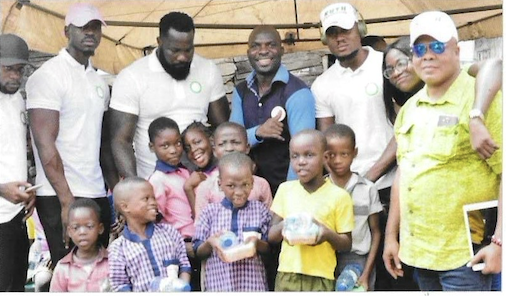 Team with children holding gifts