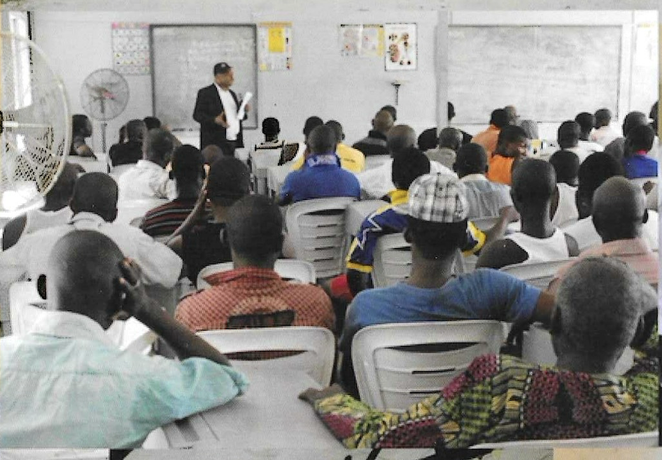 Senior Director of Programs Prince Francis Chilaka addressing a hall of inmates during KUTH Foundation's 2012 prison outreach in Lagos