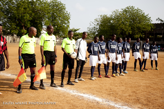 Referees and team lined up before match