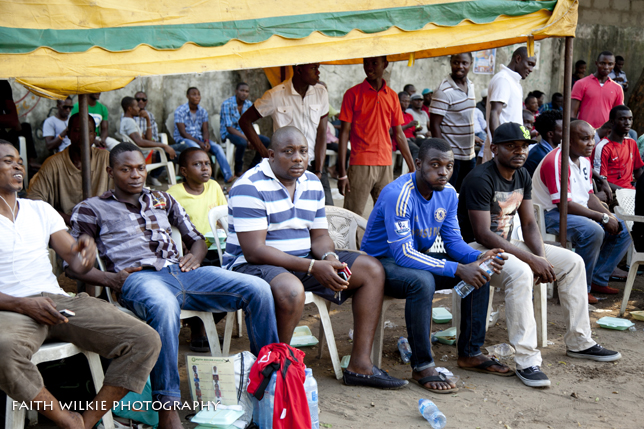 Spectators under tent watching the tournament
